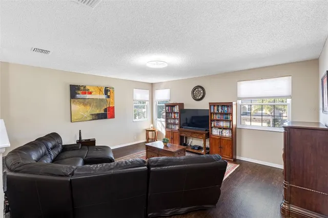 a view of walk in closet with clothes