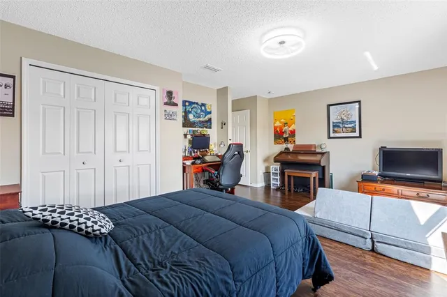 a living room with furniture and a book shelf