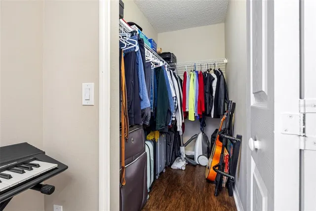 a bedroom with a bed and a television in it