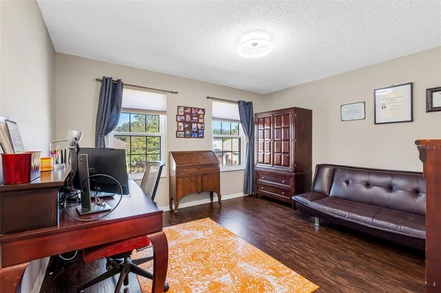 a very nice looking room with a large window and pool table