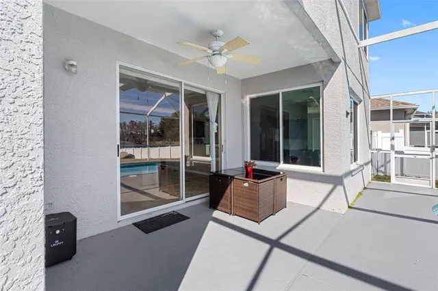 a view of a large house with a big yard and large trees