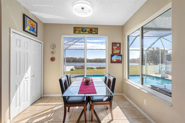 a kitchen with stainless steel appliances granite countertop a refrigerator sink and stove