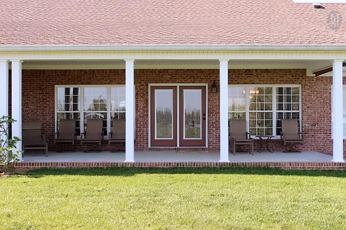 1137 Robinson Road Manchester, TN 37355 - Photo 3 of 30 RELAX ON YOUR COVERED BACK PORCH W/ A VIEW OF THE BARN AND THE FIELD.