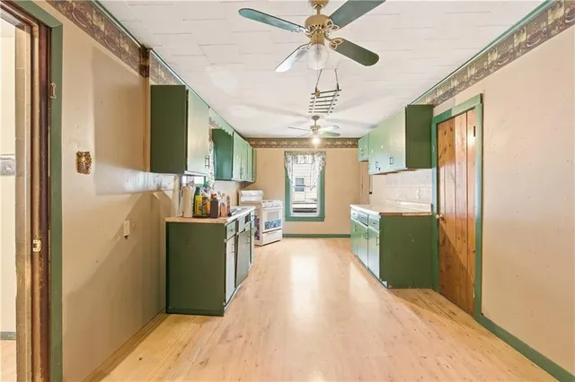 a view of a kitchen from the hallway