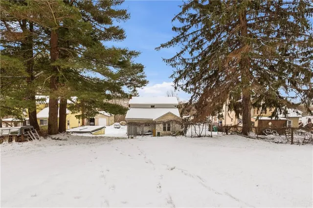 a view of a white house covered with snow