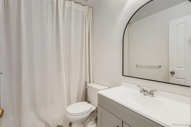 a balcony with view of outdoor seating