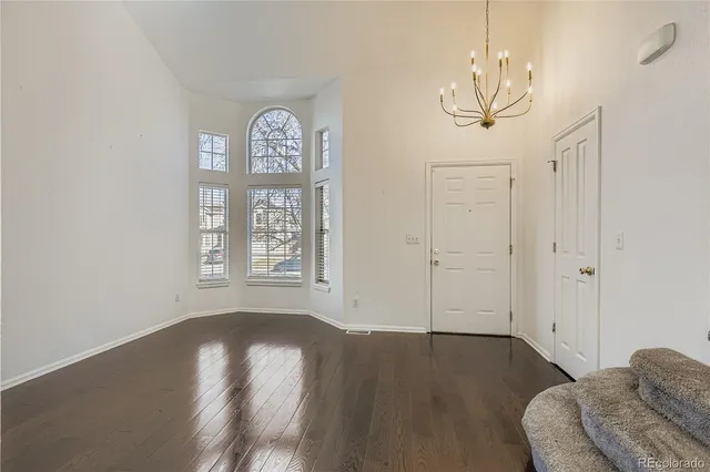 a view of a livingroom with furniture window and wooden floor