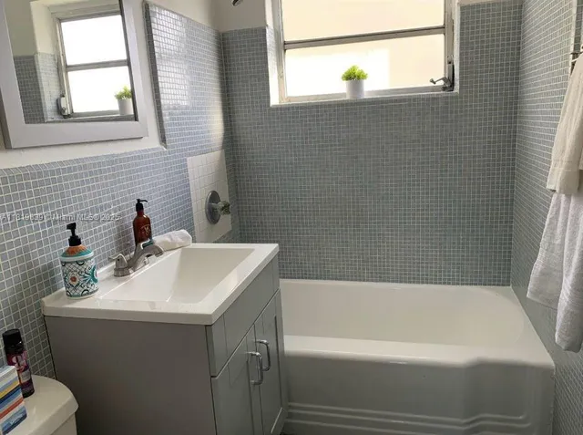 a bathroom with a sink and bathtub