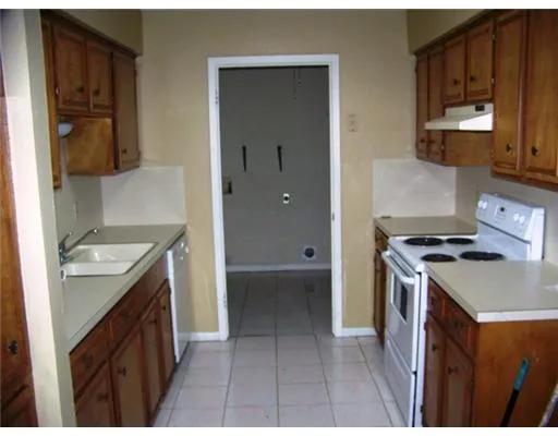 a kitchen with a stove and a sink