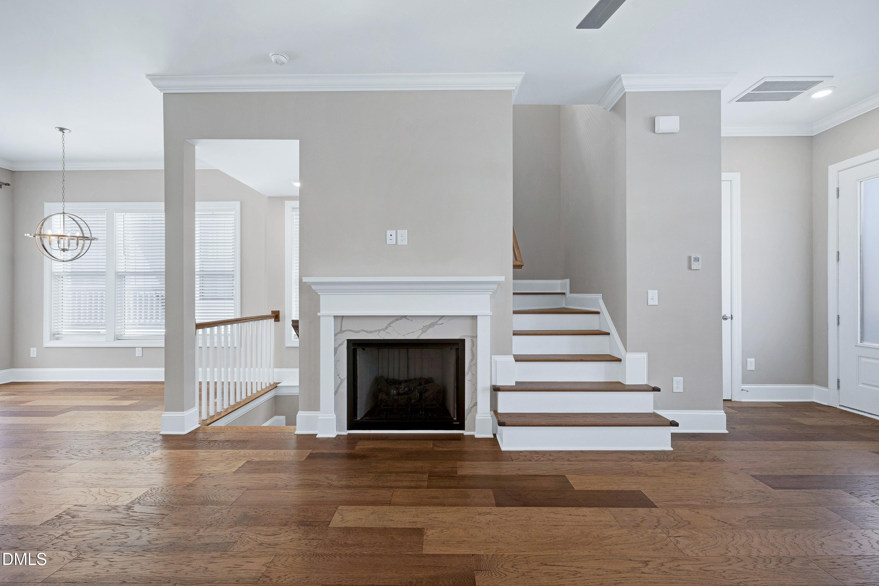 4909 Madone Drive Raleigh, NC 27606 - Photo 17 of 48 a view of a livingroom with a staircase