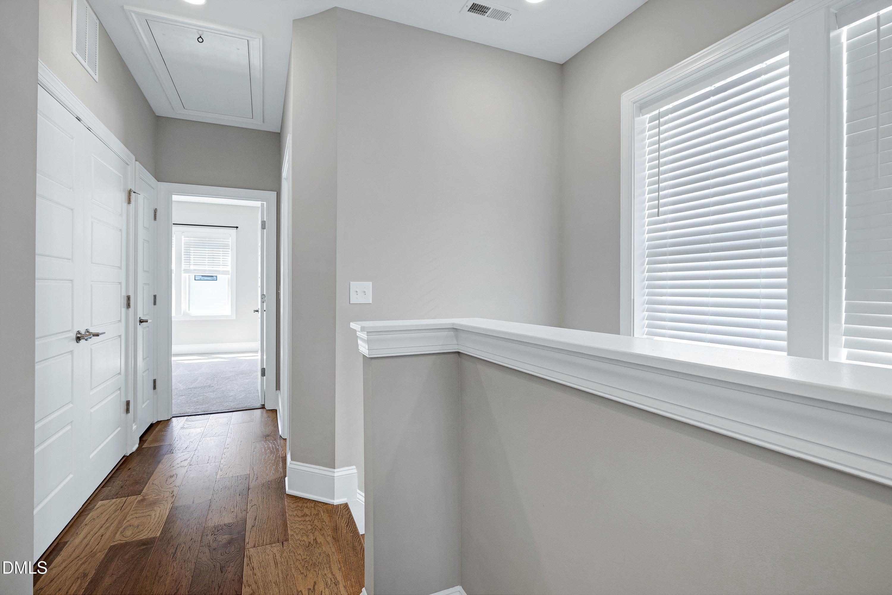 4909 Madone Drive Raleigh, NC 27606 - Photo 19 of 48 a view of an empty room with wooden floor and a window