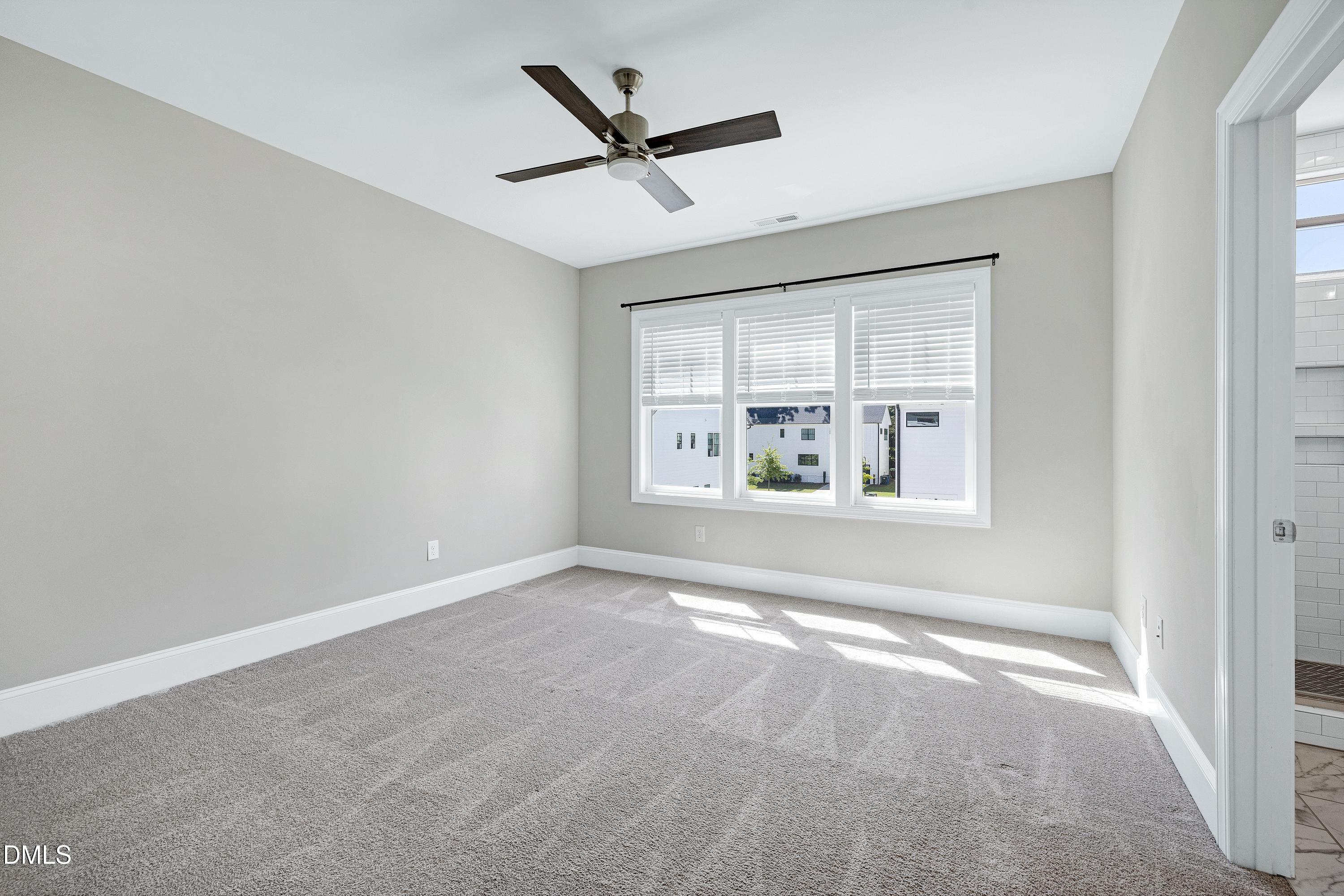 4909 Madone Drive Raleigh, NC 27606 - Photo 20 of 48 a view of an empty room with a window
