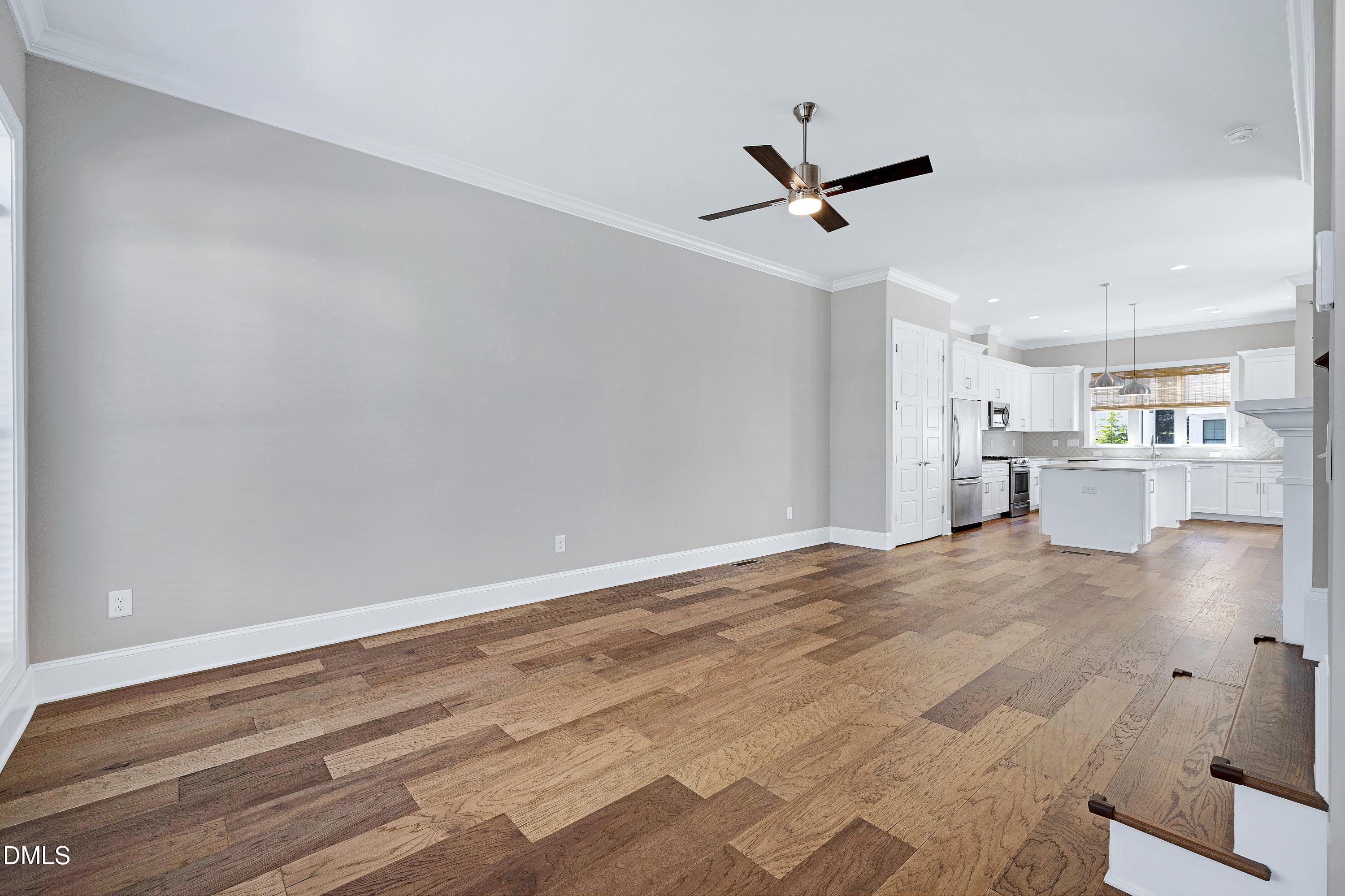 4909 Madone Drive Raleigh, NC 27606 - Photo 2 of 48 wooden floor in an empty room with a window