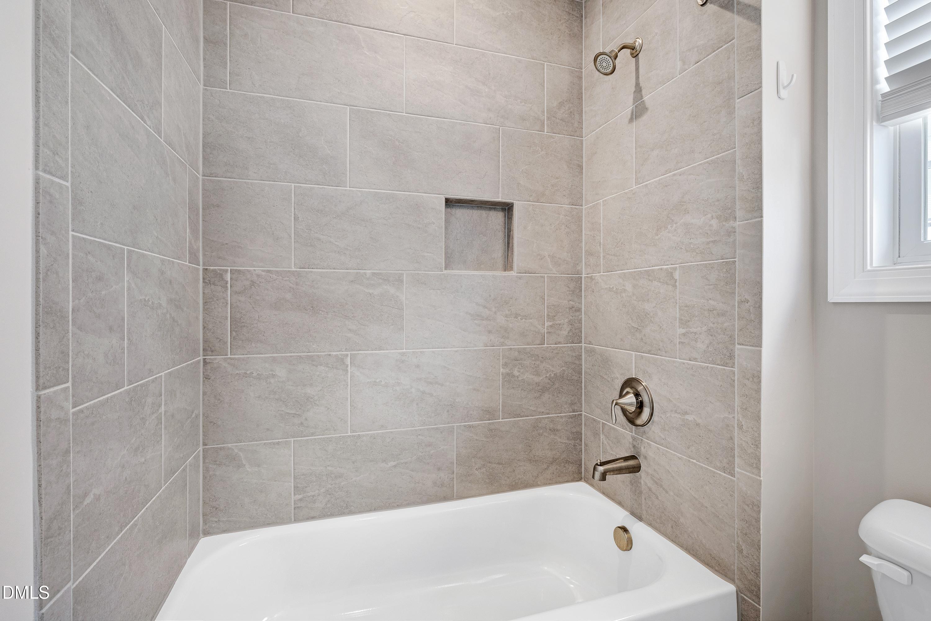 4909 Madone Drive Raleigh, NC 27606 - Photo 29 of 48 a bathroom with a bathtub