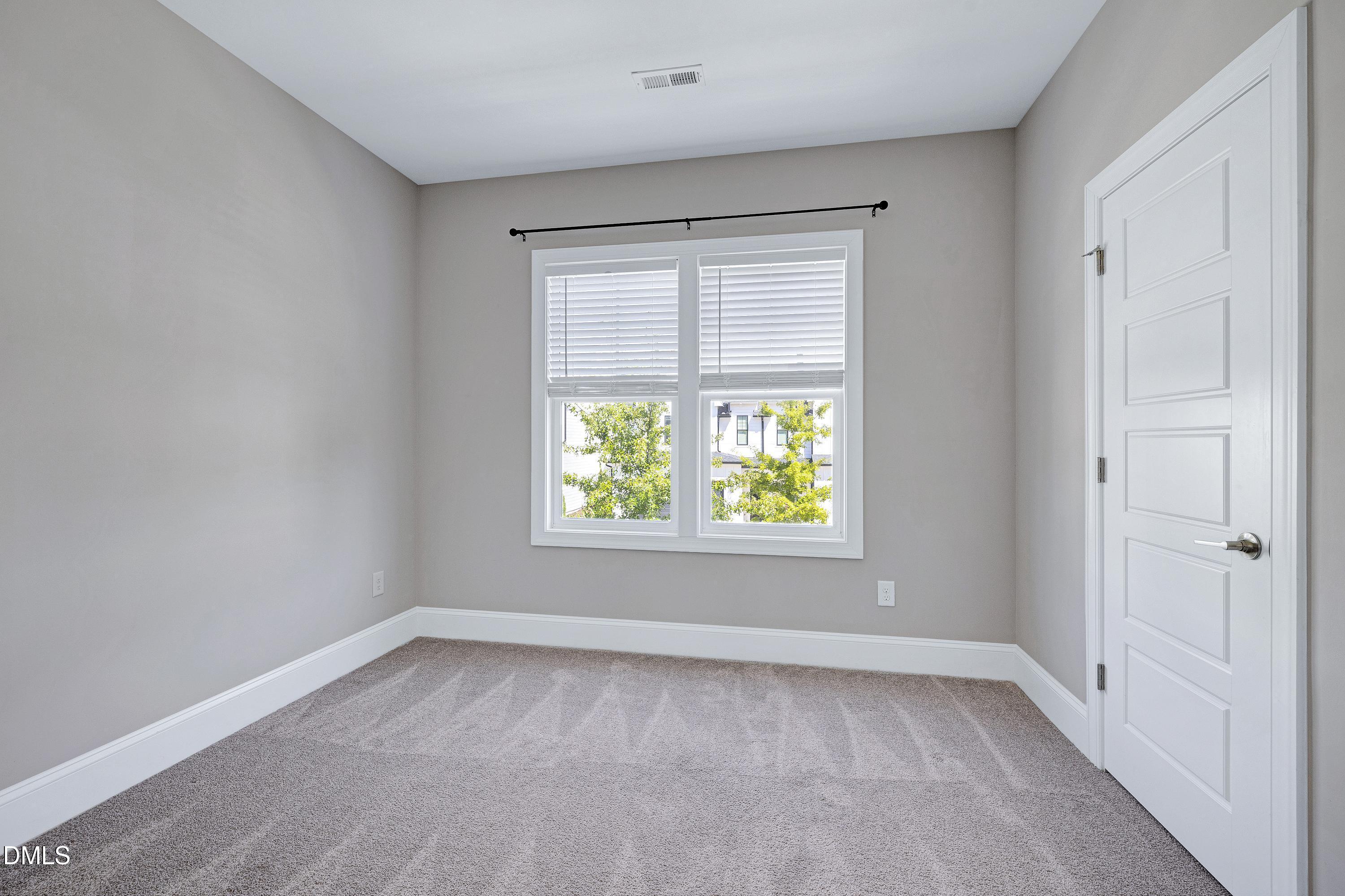 4909 Madone Drive Raleigh, NC 27606 - Photo 31 of 48 an empty room with a window