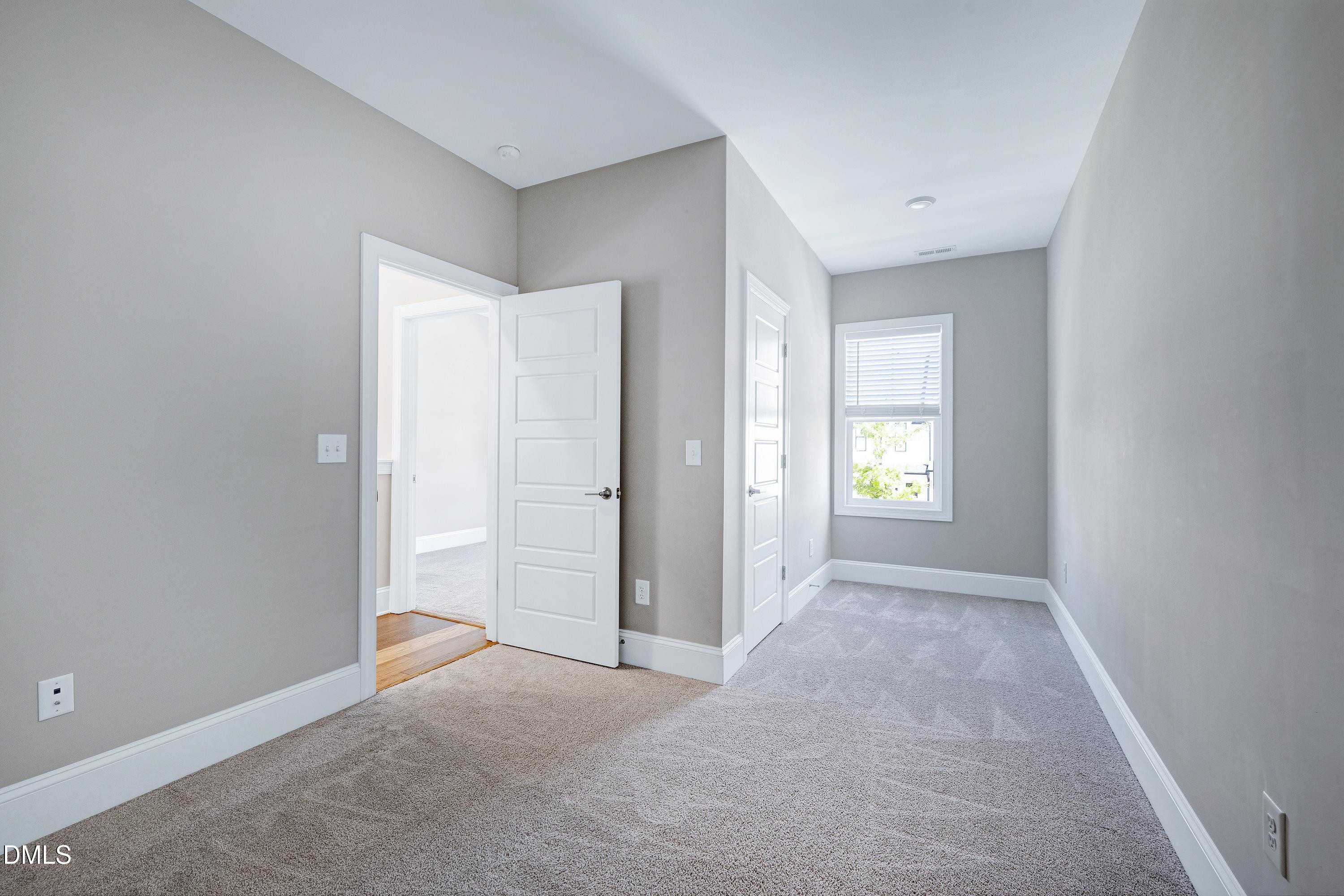4909 Madone Drive Raleigh, NC 27606 - Photo 33 of 48 an empty room with windows and closet