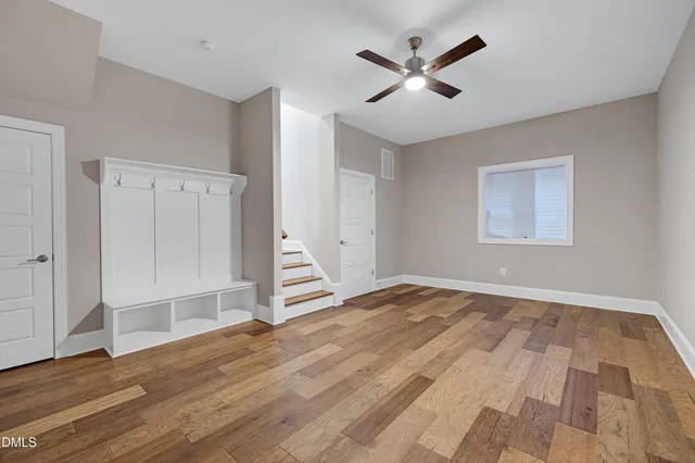 wooden floor in an empty room with a window