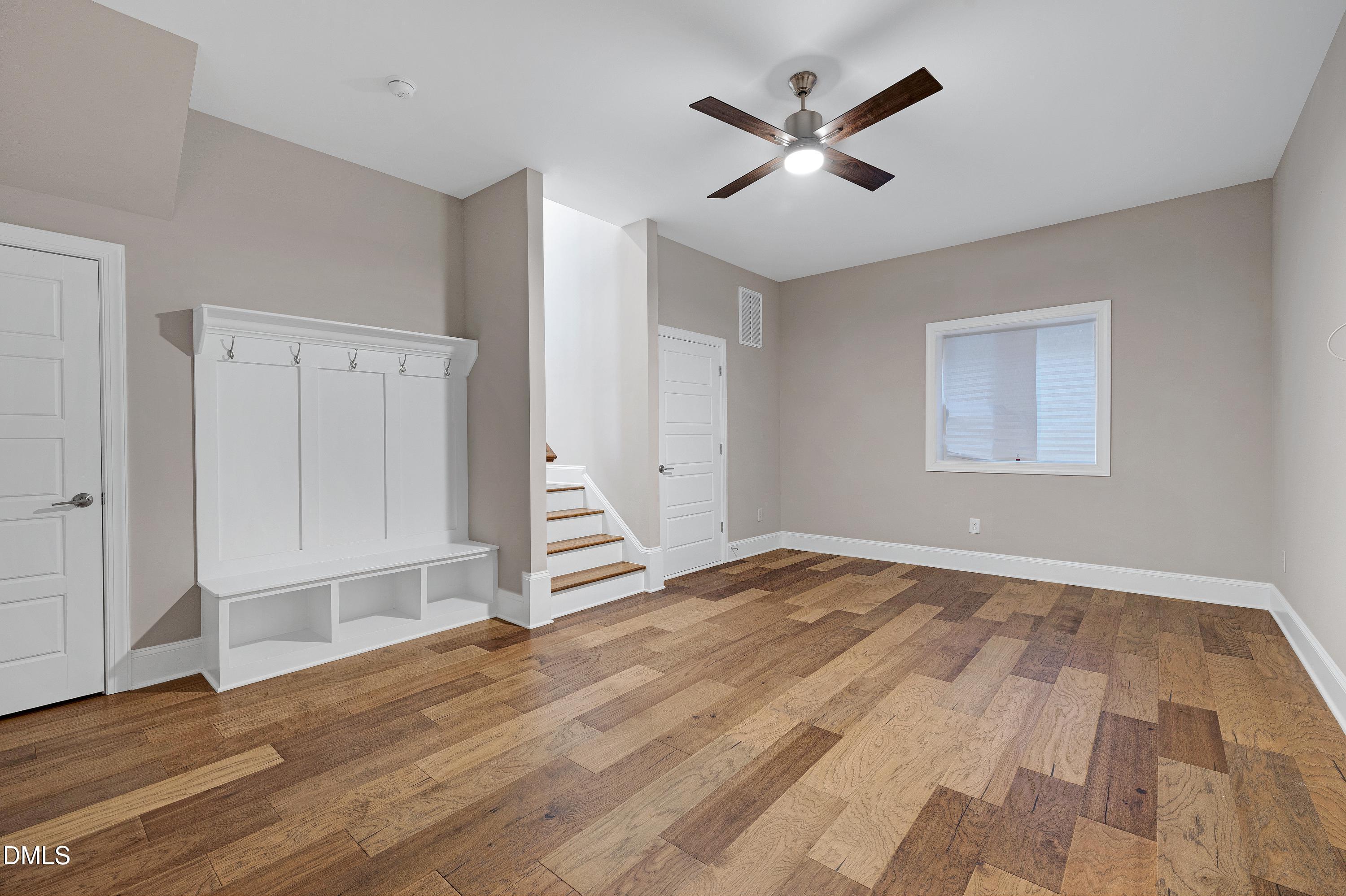 4909 Madone Drive Raleigh, NC 27606 - Photo 38 of 48 wooden floor in an empty room with a window