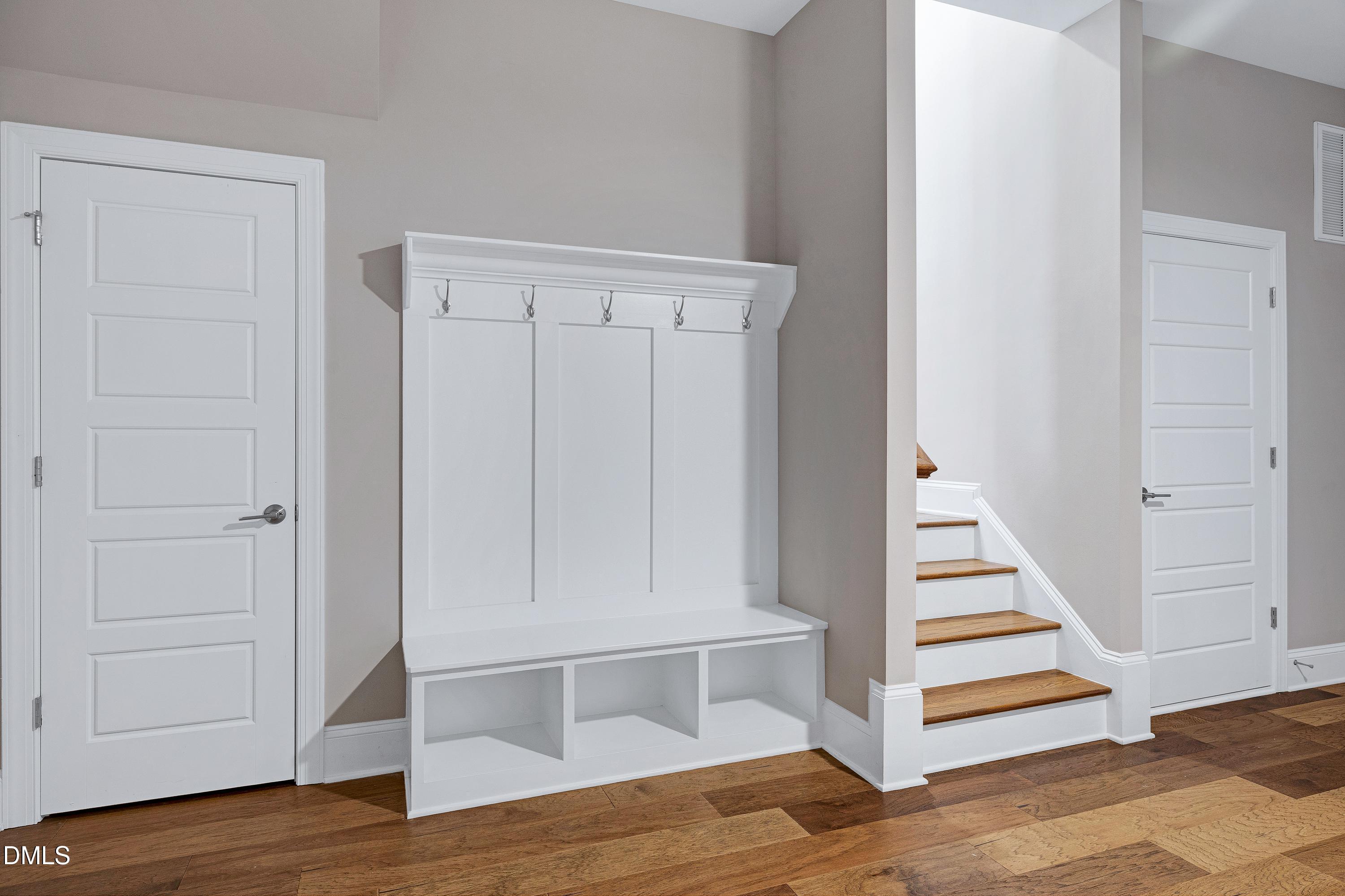 4909 Madone Drive Raleigh, NC 27606 - Photo 39 of 48 a view of an entryway with wooden floor