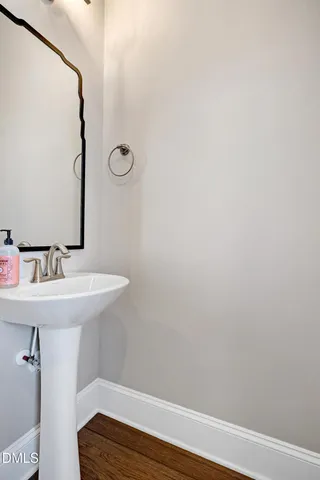 a bathroom with a sink and mirror