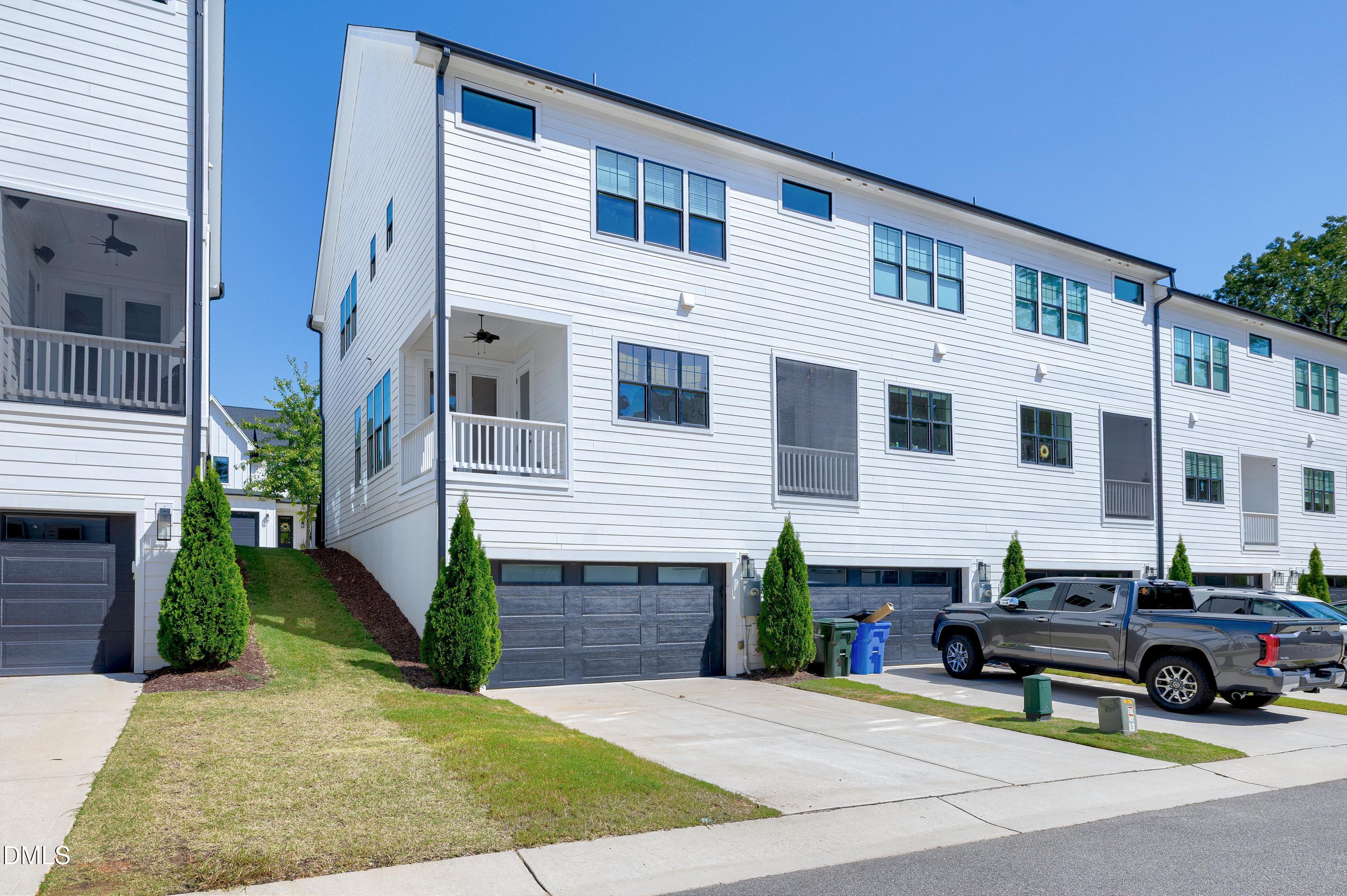 4909 Madone Drive Raleigh, NC 27606 - Photo 47 of 48 a view of house with outdoor space and sitting space