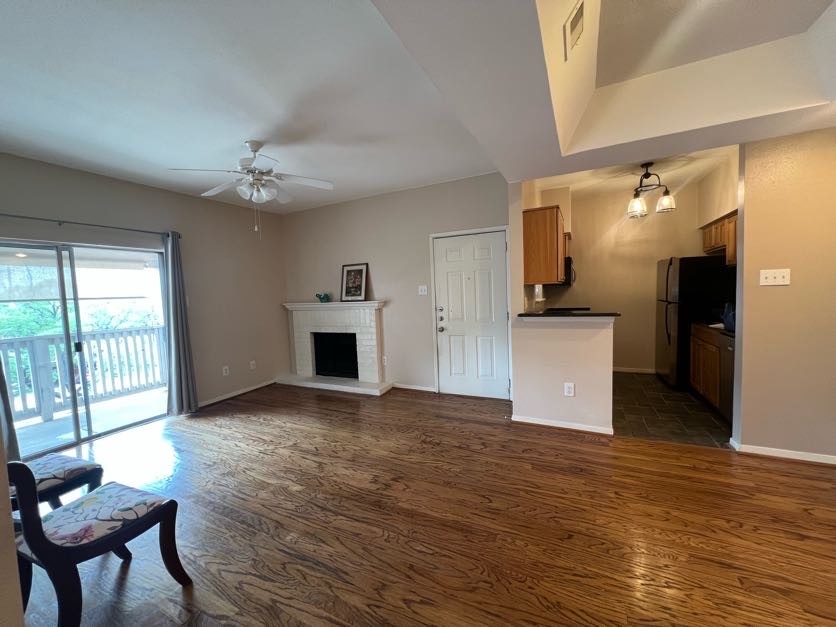 4041 Drake Street, Unit 118 Houston, TX 77005 - Photo 6 of 22 a view of a livingroom with a kitchen and a stove