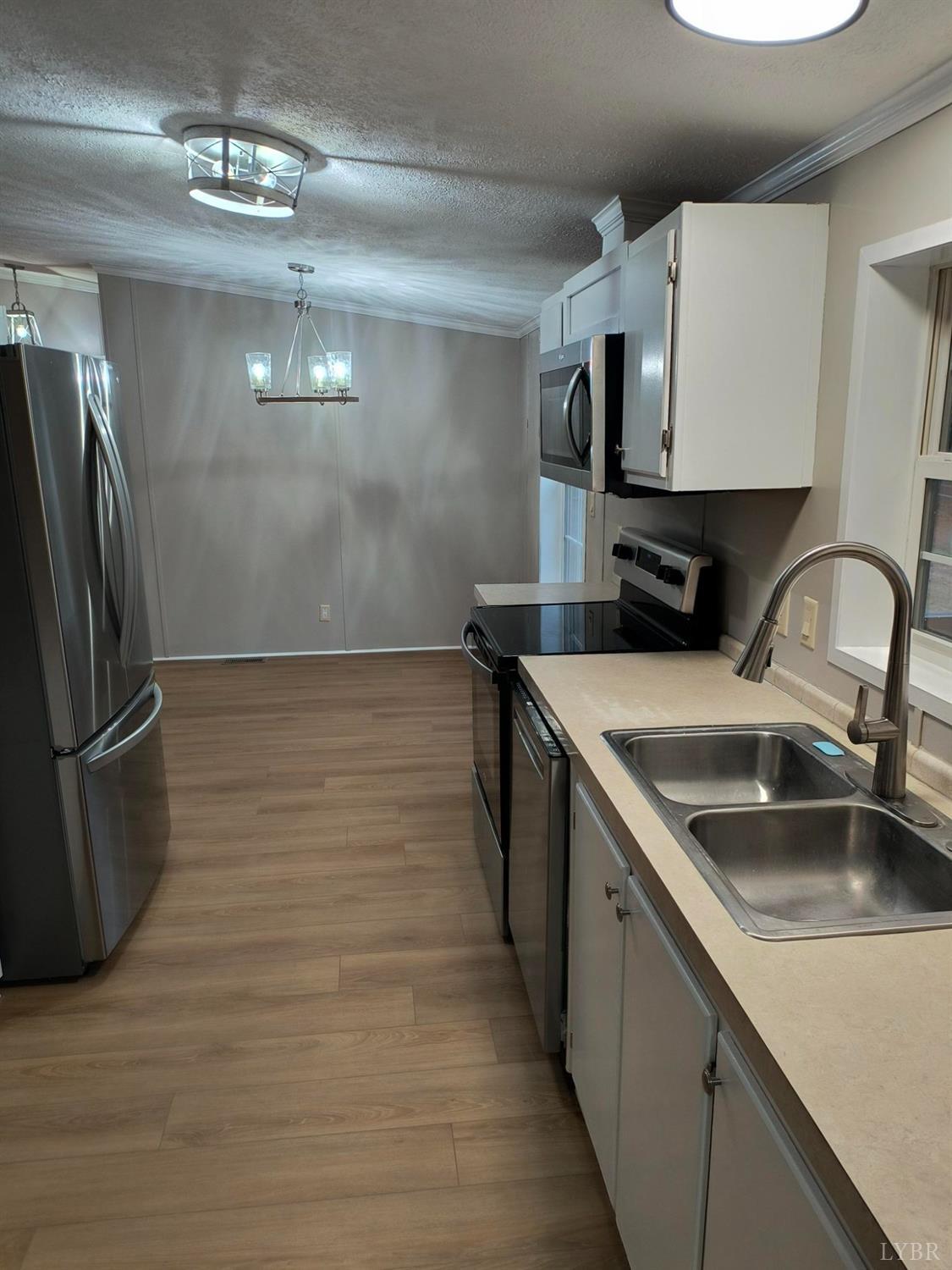 345-345 Double Bridge Road Chatham, VA 24531 - Photo 54 of 78 a kitchen with stainless steel appliances granite countertop a sink stove and refrigerator