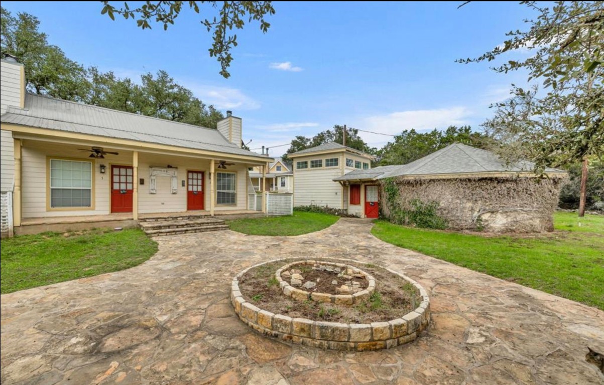 251 Circle Drive Wimberley, TX 78676 - Photo 13 of 32 front view of a house with a yard