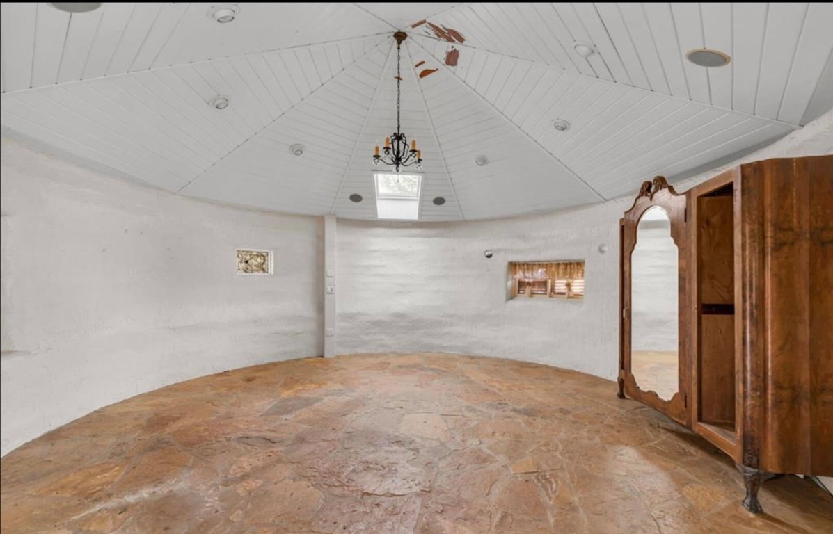 251 Circle Drive Wimberley, TX 78676 - Photo 17 of 32 a view of a hallway with a chandelier