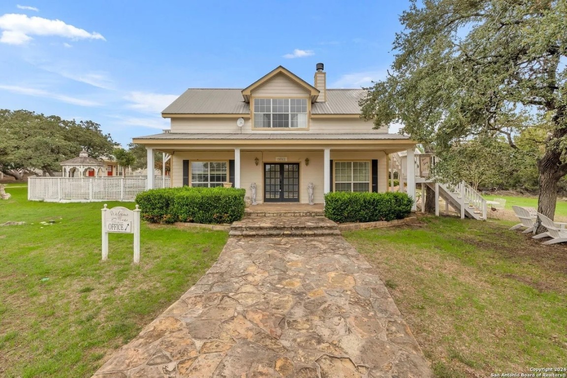 251 Circle Drive Wimberley, TX 78676 - Photo 2 of 32 a front view of a house with a yard