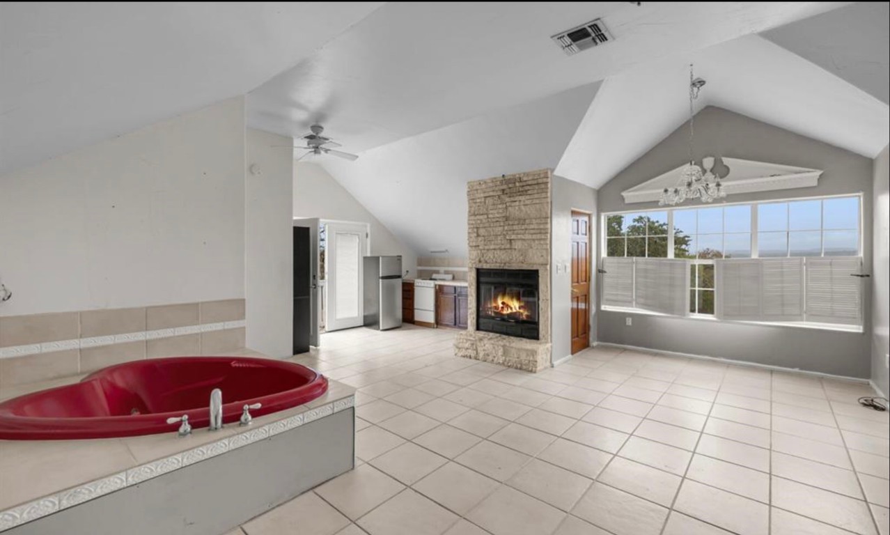 251 Circle Drive Wimberley, TX 78676 - Photo 29 of 32 a living room with furniture and a fireplace