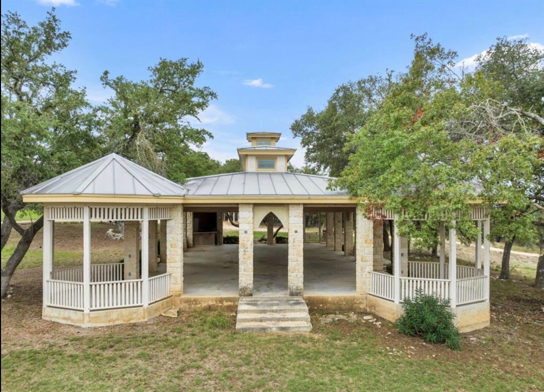 251 Circle Drive Wimberley, TX 78676 - Photo 5 of 32 a front view of a house with a porch