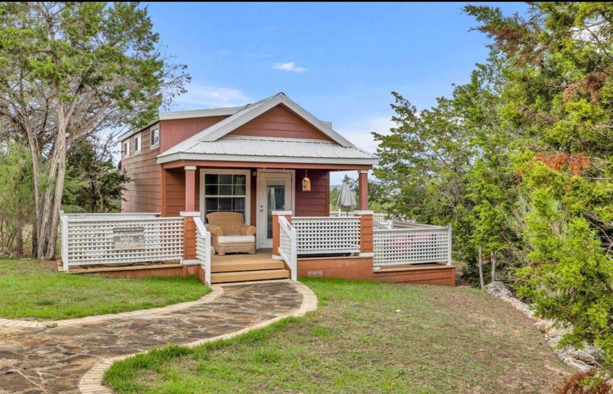 251 Circle Drive Wimberley, TX 78676 - Photo 6 of 32 front view of a house with a yard