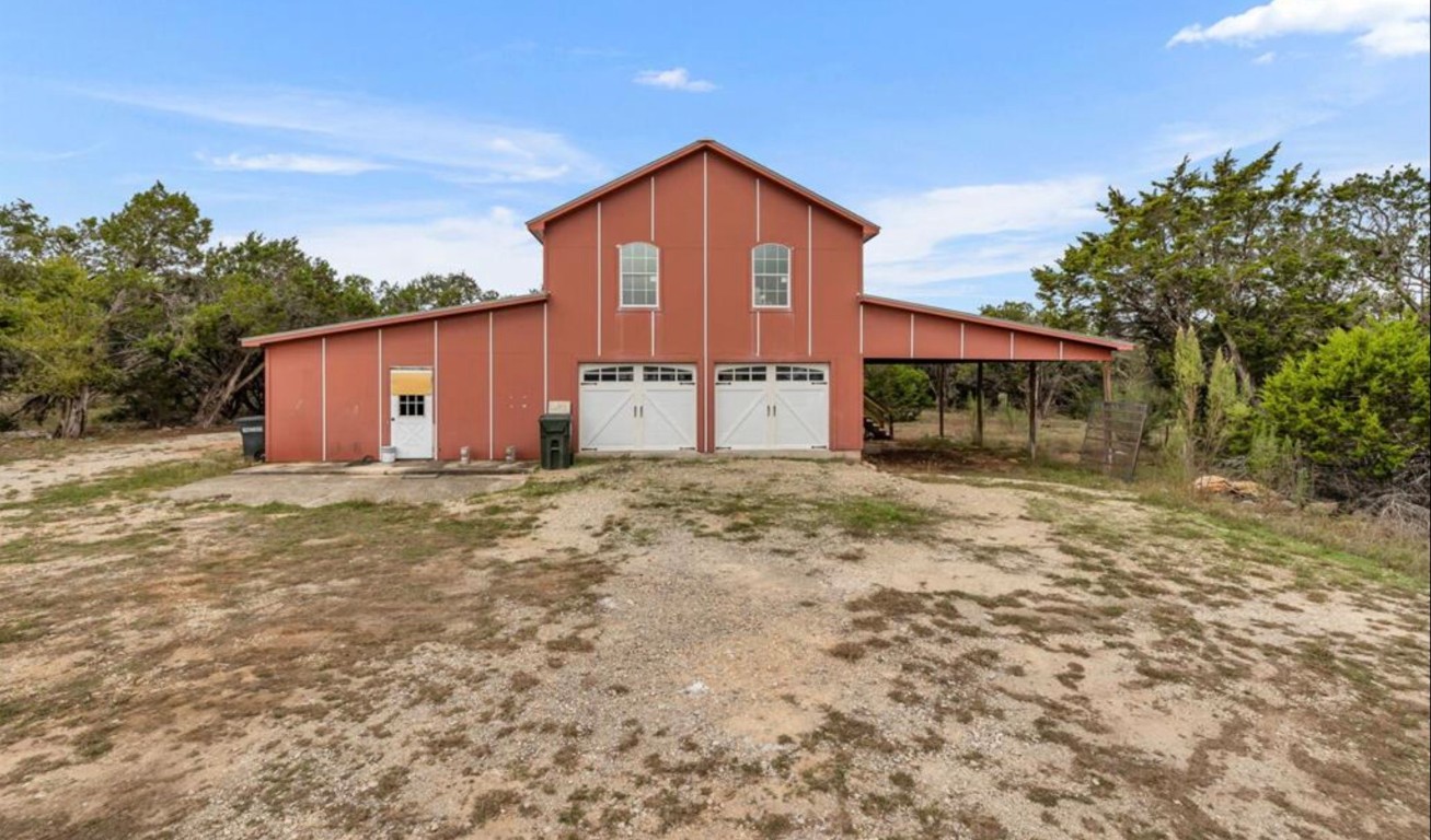 251 Circle Drive Wimberley, TX 78676 - Photo 7 of 32 a front view of a house with a yard