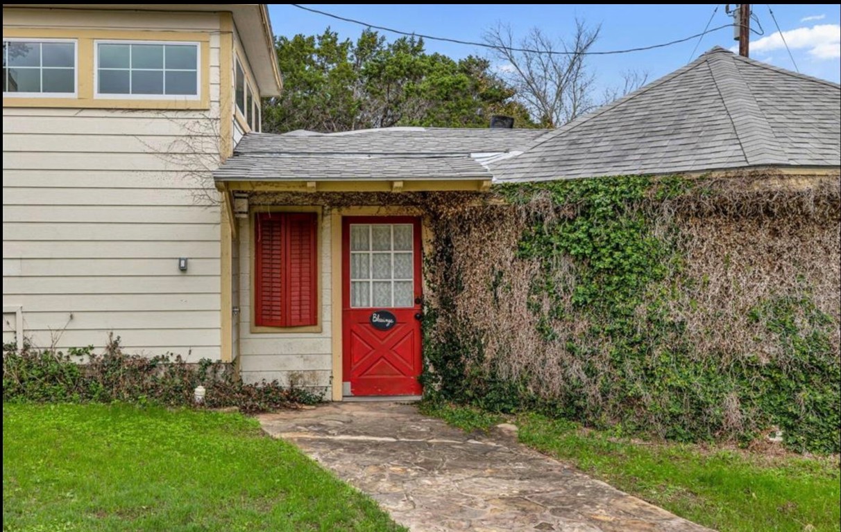251 Circle Drive Wimberley, TX 78676 - Photo 10 of 32 a front view of a house with garden