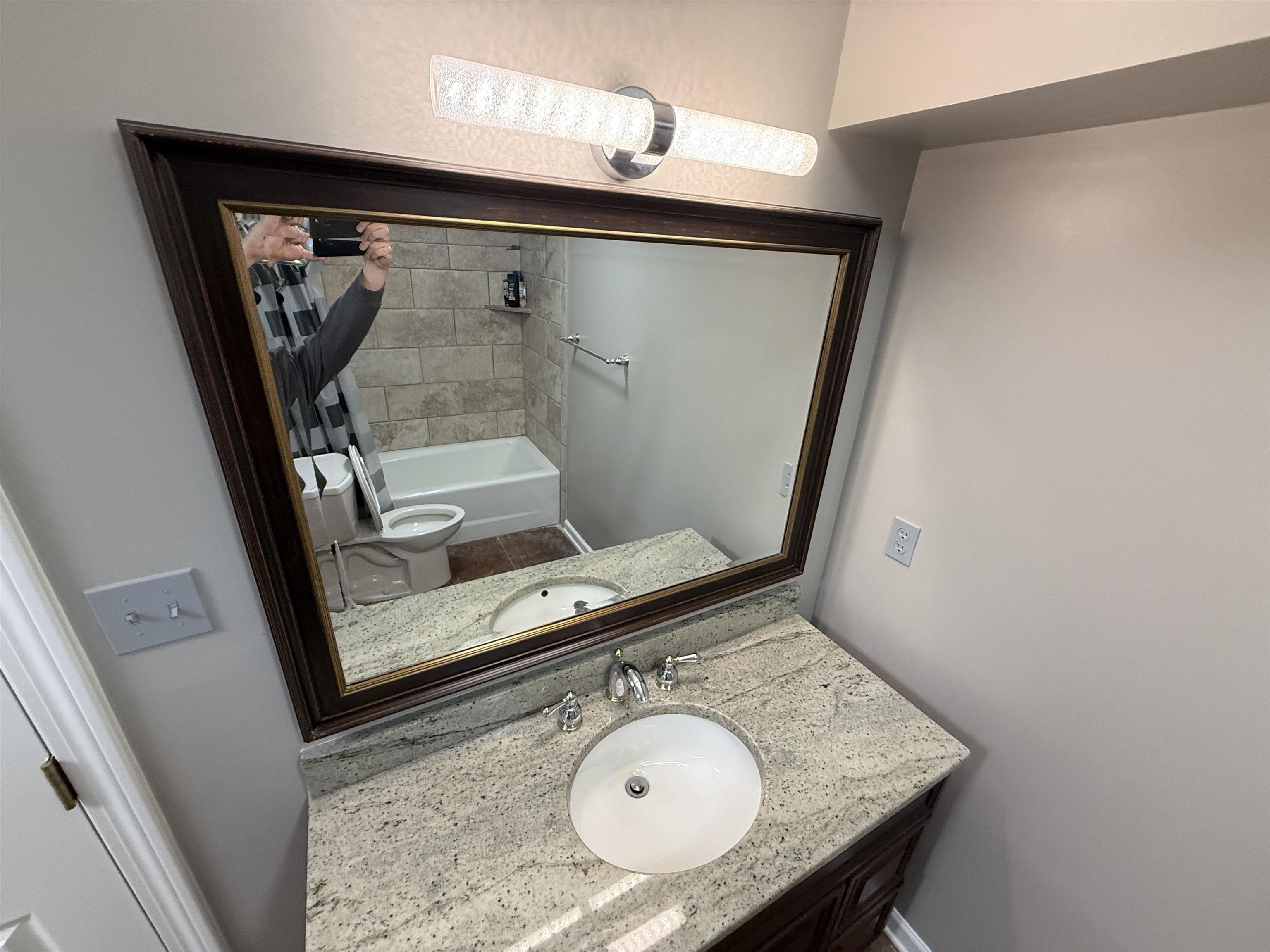 765 Sweetbrier Road Memphis, TN 38120 - Photo 21 of 33 Full bath featuring vanity and shower / bathtub combination with curtain