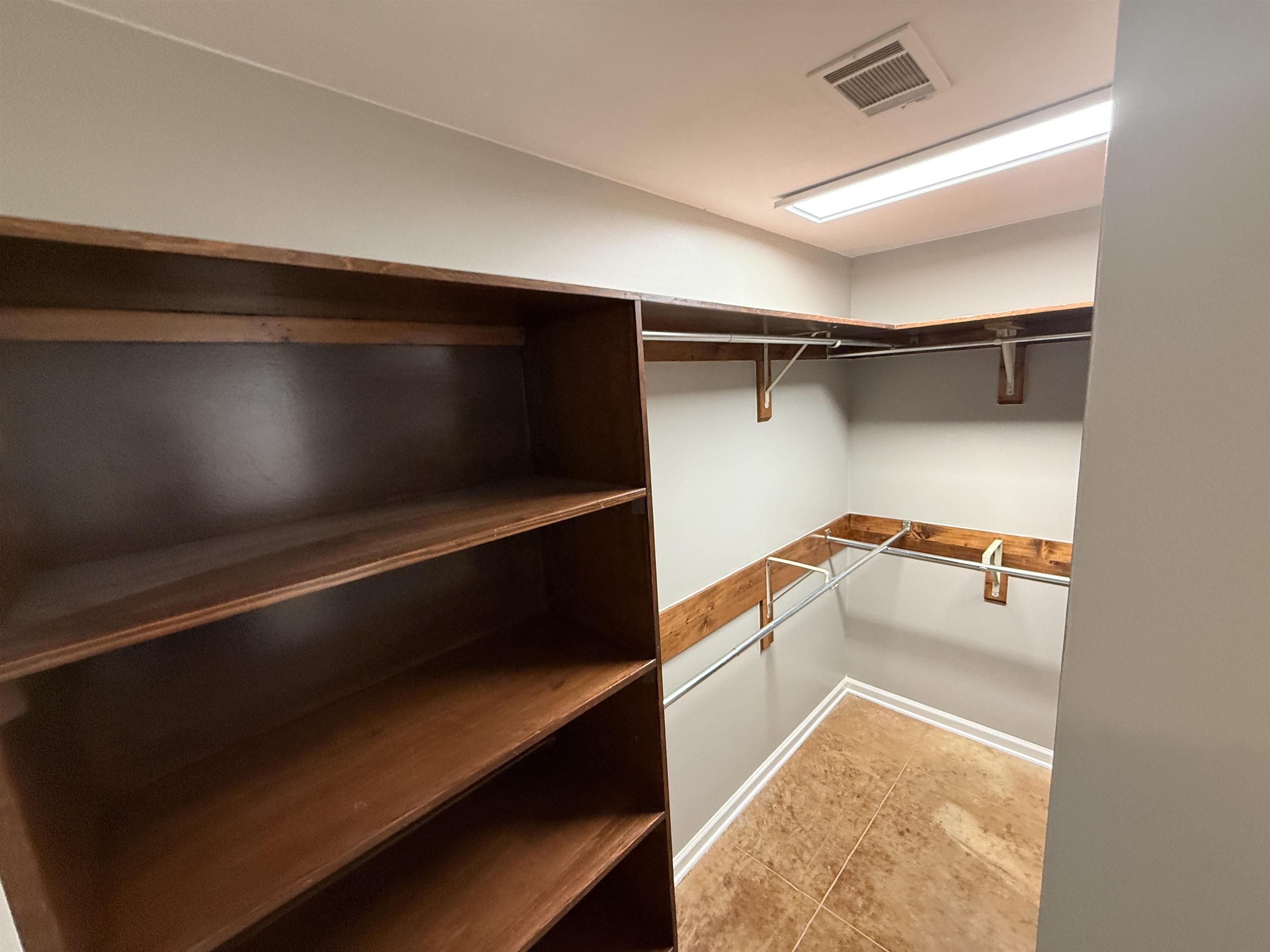 765 Sweetbrier Road Memphis, TN 38120 - Photo 23 of 33 Walk in closet featuring light tile patterned floors