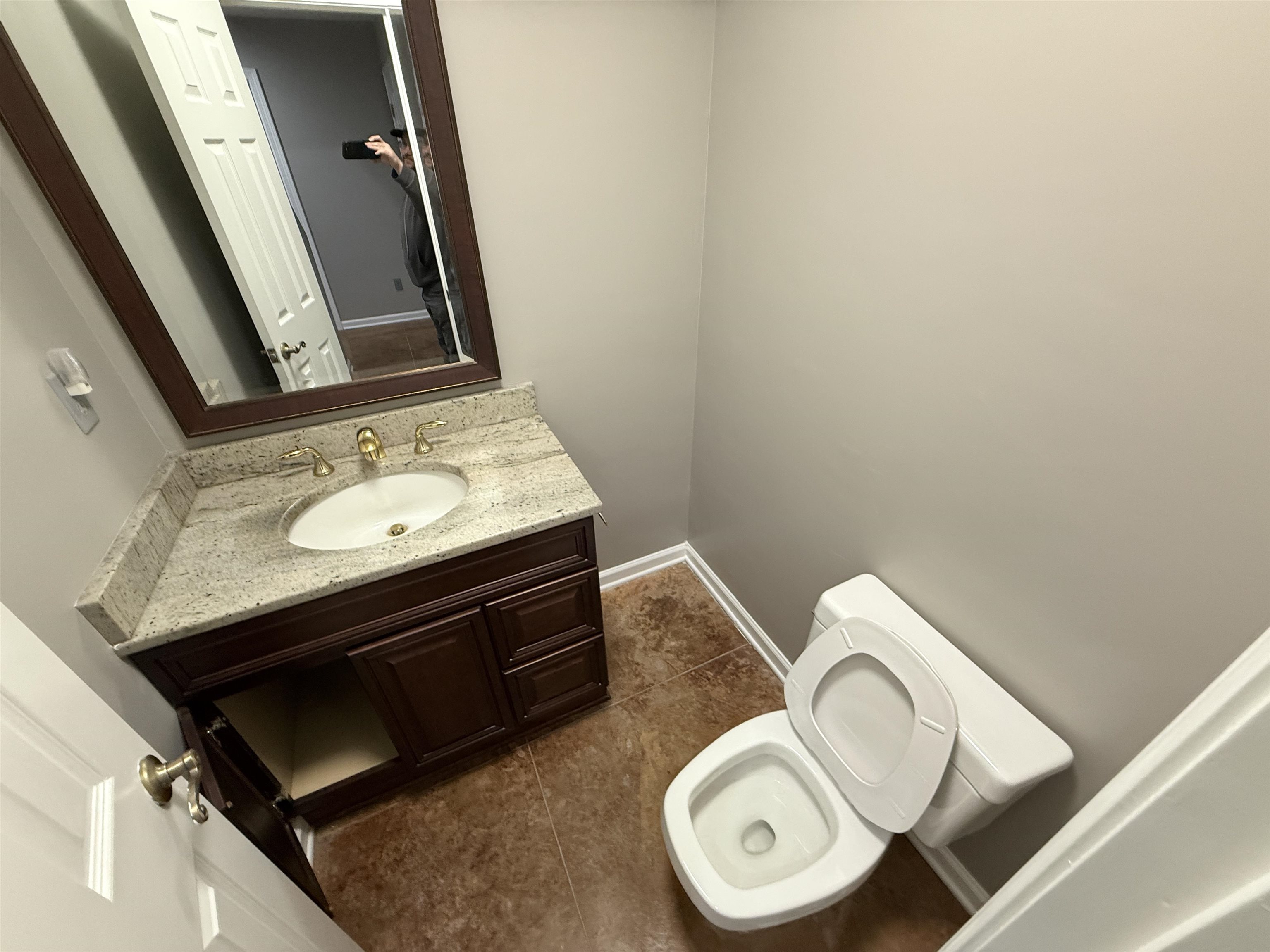 765 Sweetbrier Road Memphis, TN 38120 - Photo 25 of 33 Bathroom with vanity and dark tile patterned flooring