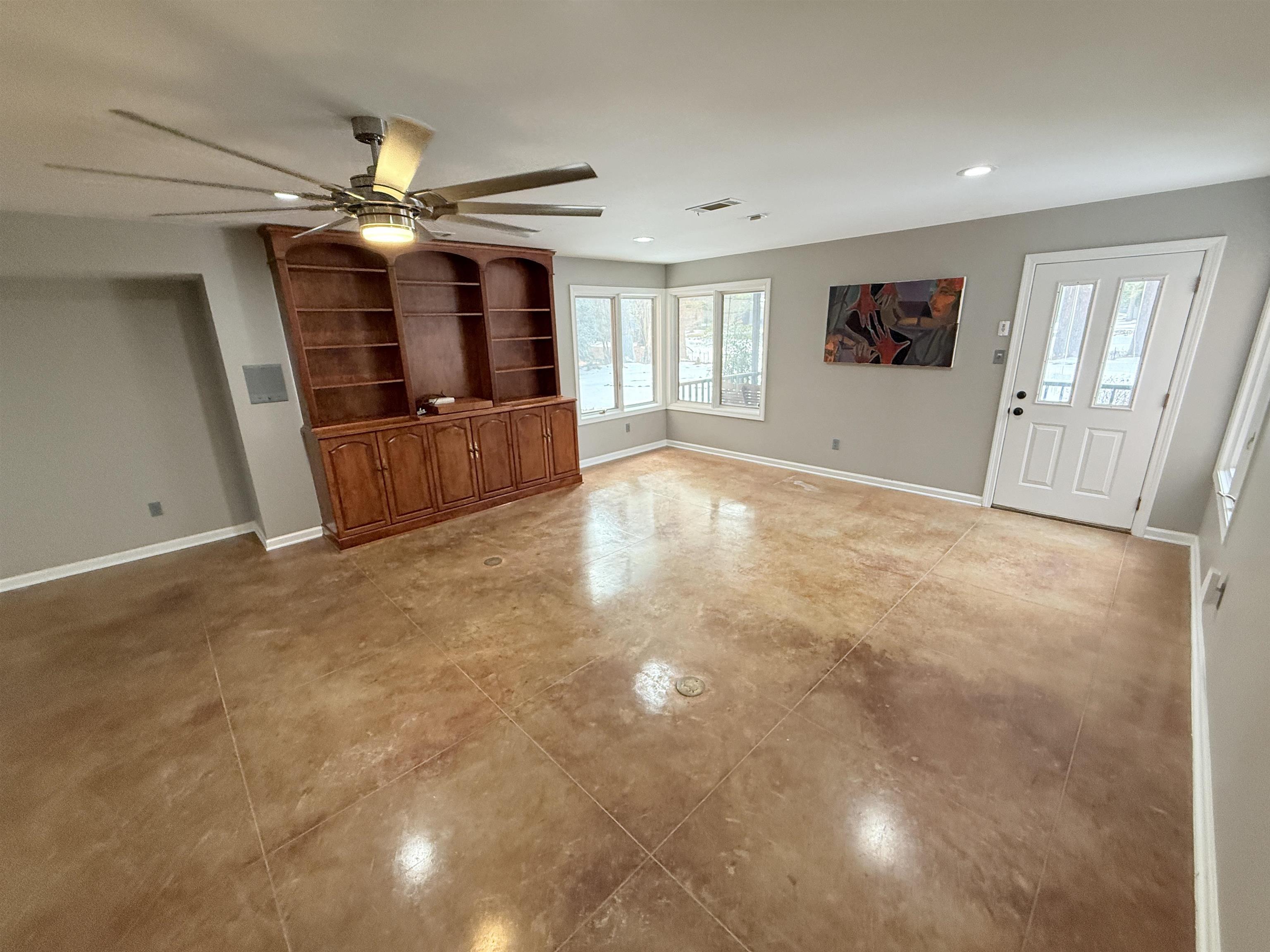 765 Sweetbrier Road Memphis, TN 38120 - Photo 31 of 33 Unfurnished living room featuring a ceiling fan and recessed lighting