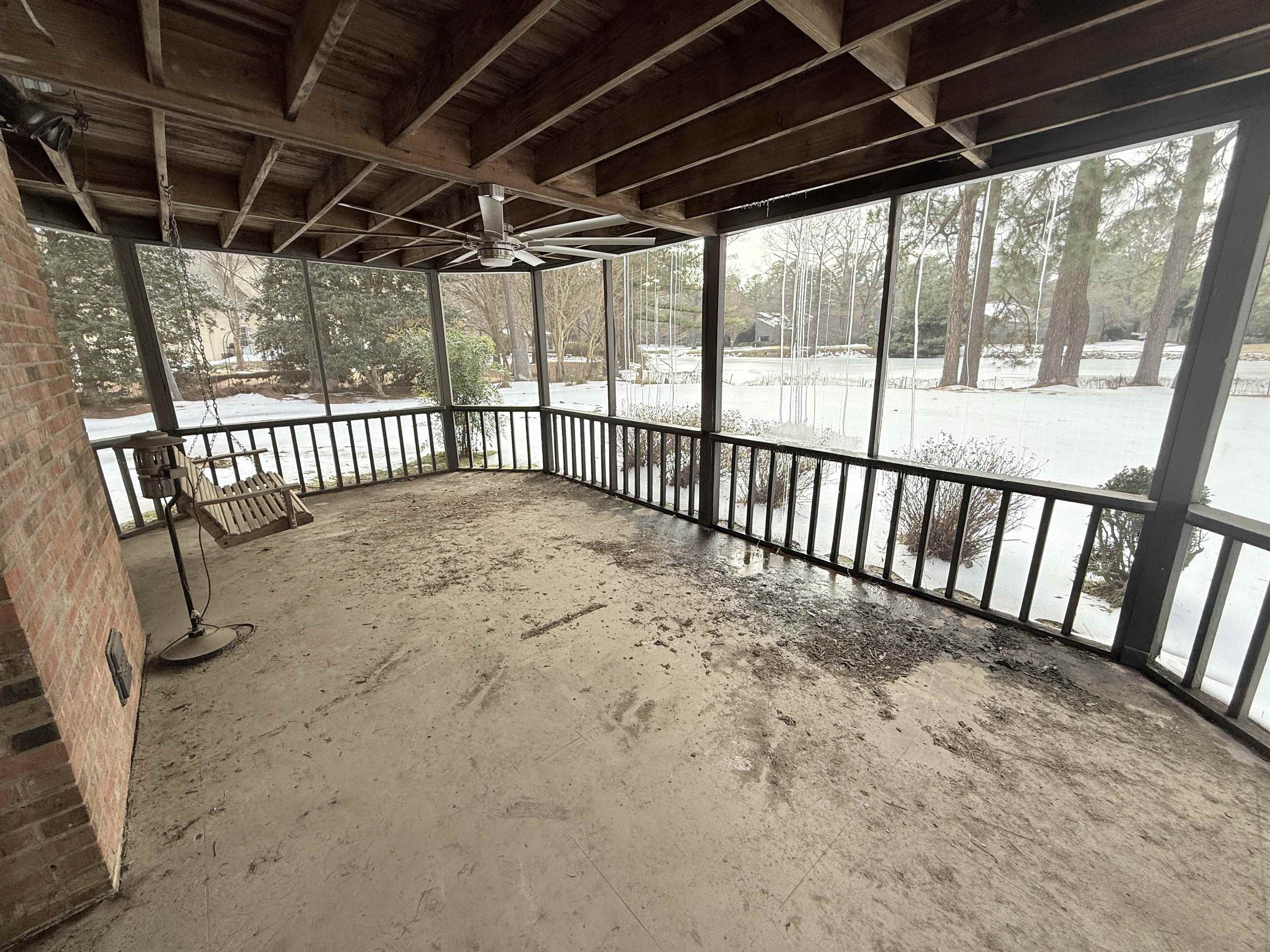 765 Sweetbrier Road Memphis, TN 38120 - Photo 32 of 33 Snow covered patio with a sunroom