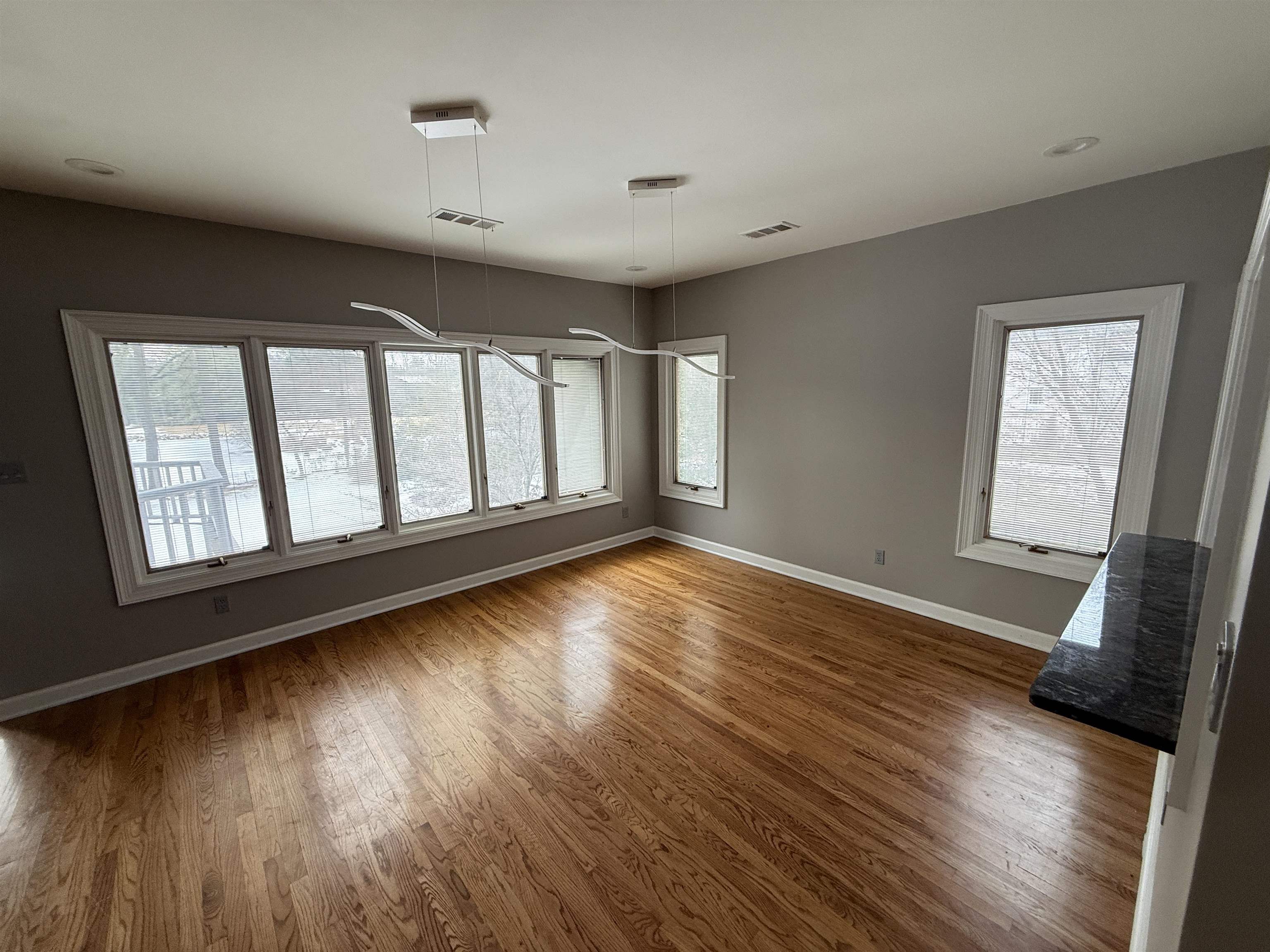 765 Sweetbrier Road Memphis, TN 38120 - Photo 6 of 33 Unfurnished dining area featuring dark wood-style floors and baseboards