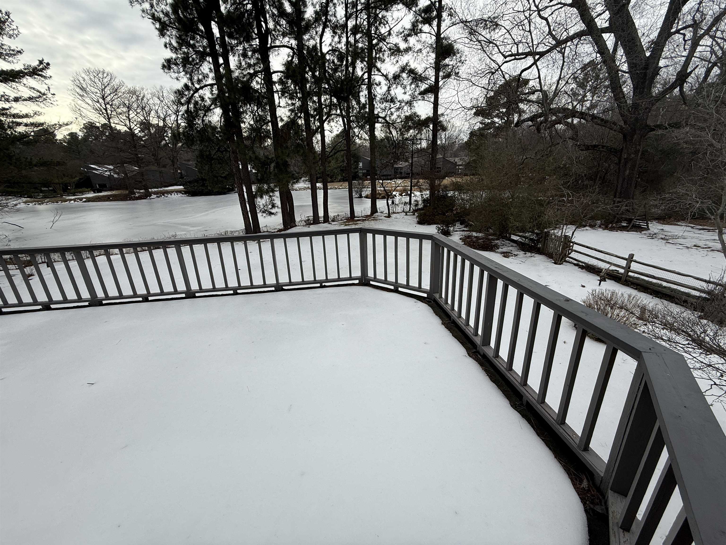 765 Sweetbrier Road Memphis, TN 38120 - Photo 8 of 33 Snow covered deck with view of scattered trees