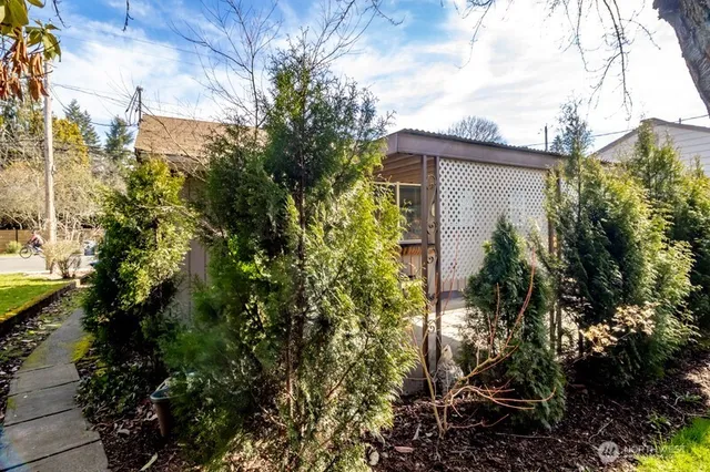 a view of a house with a tree