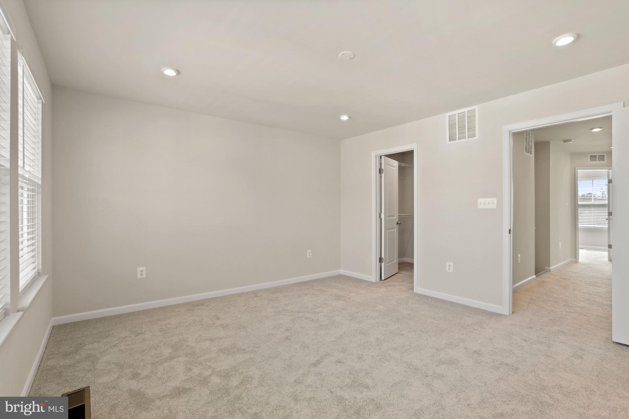 3970 Shire Meadow Lane Triangle, VA 22172 - Photo 26 of 52 an empty room with windows and closet