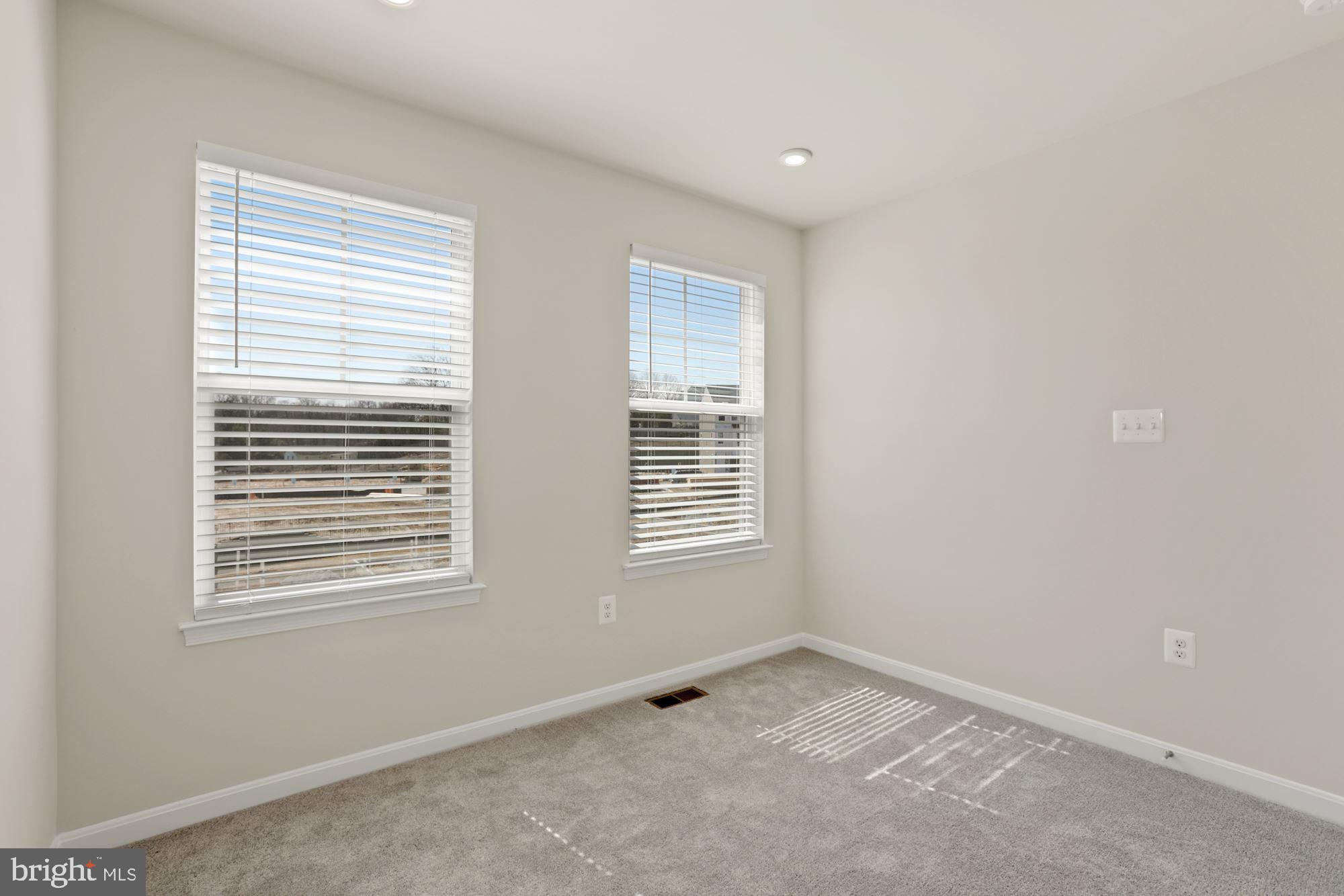 3970 Shire Meadow Lane Triangle, VA 22172 - Photo 31 of 52 a view of an empty room with a window