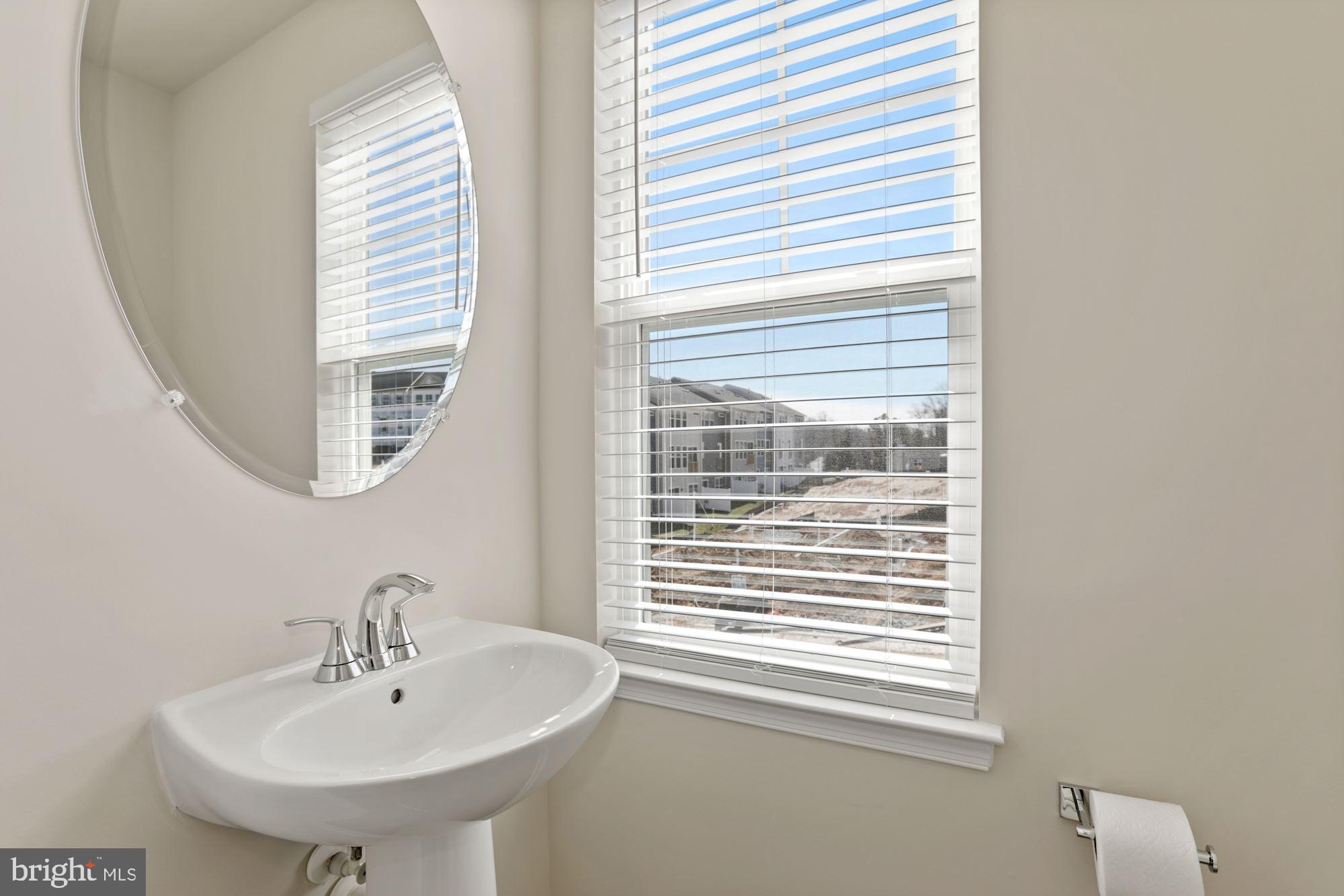 3970 Shire Meadow Lane Triangle, VA 22172 - Photo 40 of 52 a bathroom with a sink and a window