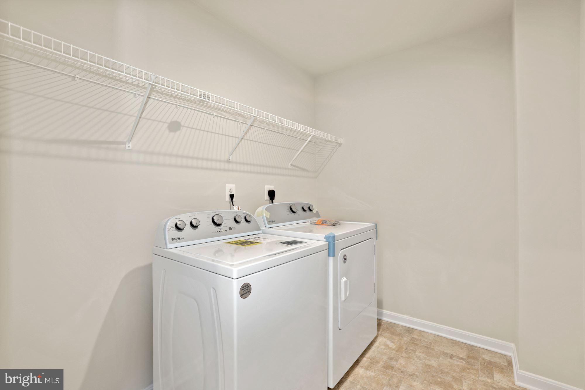 3970 Shire Meadow Lane Triangle, VA 22172 - Photo 45 of 52 a utility room with dryer and washer