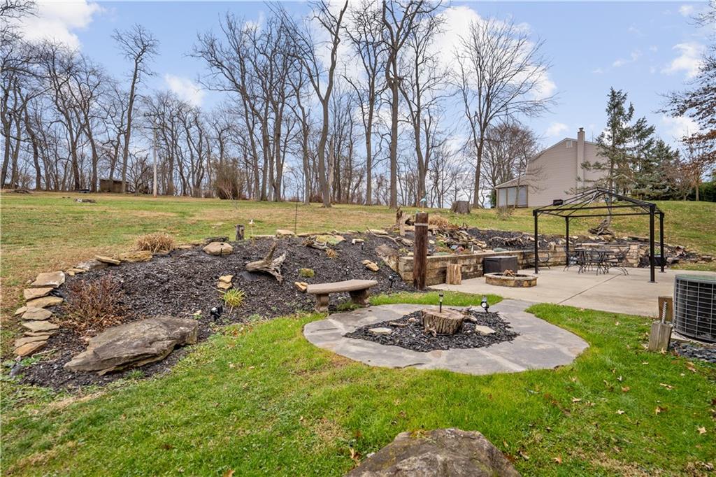 355 Middletown Road New Stanton, PA 15672 - Photo 18 of 21 a view of a water fountain in a yard with palm trees