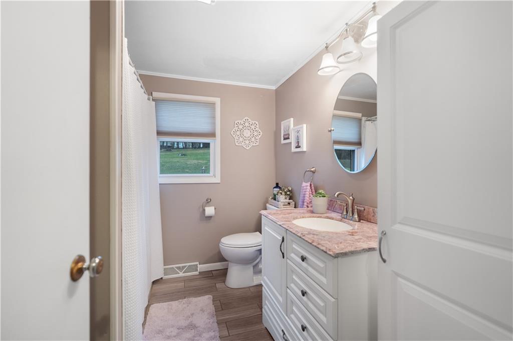 355 Middletown Road New Stanton, PA 15672 - Photo 8 of 21 a bathroom with a sink toilet and a mirror