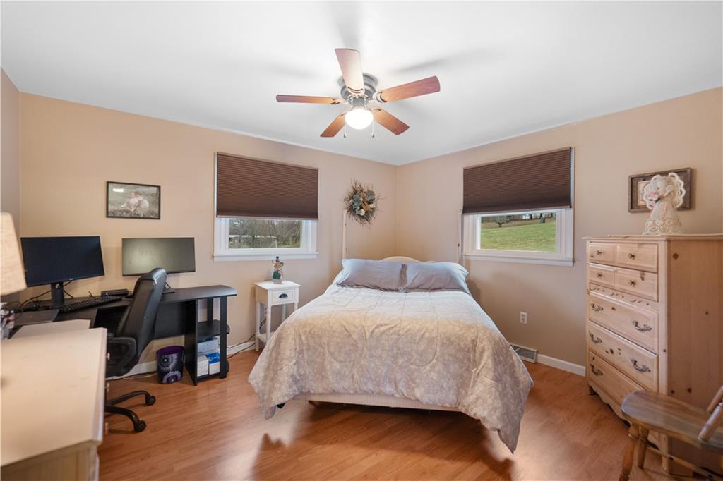 355 Middletown Road New Stanton, PA 15672 - Photo 10 of 21 a bedroom with a bed and a flat screen tv